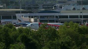 PHUKET, THAILAND NOVEMBER 30, 2019 - AirAsia Airbus A320 landing on the runway at Phuket airport. video