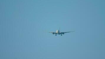 Widebody airplane approaching over ocean before landing in Phuket airport video