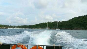 Point of view video of a speed boat rushing from the islands of Racha on Phuket beach. Tourism and travel concept