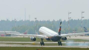 MOSCOW, RUSSIAN FEDERATION JULY 29, 2021 - Airbus of Aeroflot landing at Shermetyevo International Airport, Moscow SVO. Tourism and travel concept. Rear view of the landing or arrival of an airplane video
