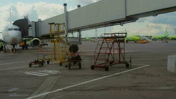 MOSCOW, RUSSIAN FEDERATION JULY 24, 2021 - View of the airfield of the airport Domodedovo, Moscow. S7 Airlines aircraft stands at the telescopic bridge video