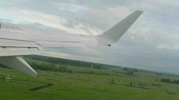 The aircraft departing from airport of Novosibirsk, view from the airplane porthole. video