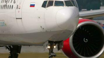 MOSCOW, RUSSIAN FEDERATION JULY 29, 2021 - Jet plane of Royal Flight taxiing at Sheremetyevo airport, front view. Aircraft engine and nose, taxiing. Concept aviation and tourism video