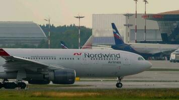 MOSCOW, RUSSIAN FEDERATION JULY 30, 2021 - Passenger plane Airbus A330 of Nordwind Airlines taxiing at Sheremetyevo Airport Moscow. Tourism and travel concept video