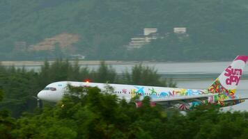 PHUKET, THAILAND NOVEMBER 28, 2019 - Boeing 757 21B, UP B5702 of Sunday Airlines arriving at Phuket Airport. Tourism and travel concept video