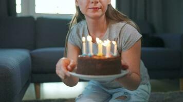 Woman celebrating birthday at home alone with birthday cake video
