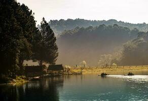 Maehongson, Thailand - December 12, 2016 Beautiful view pine forests with gold light in the morning, Pang Oung reservoir photo