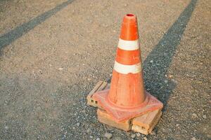 The old traffic cone on the road photo