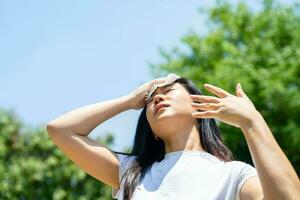 Front view portrait of a stressed teen suffering heat stroke photo