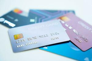 Credit cards stacked on white background photo