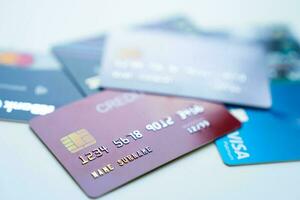 Pile of credit cards on table, closeup photo