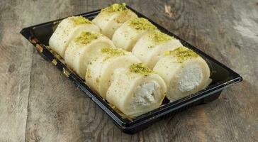 Arabic sweets called halawa el jubn, Delicious Arabic,Syrian sweets photo