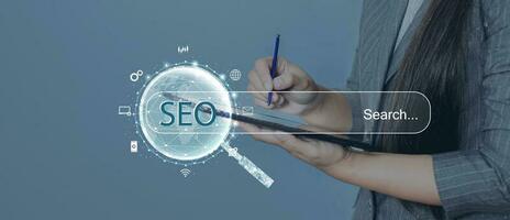 Search engine optimization SEO concept on dark blue background. Internet technology for business companies. Large magnifying glass for monitoring and analyzing data. photo