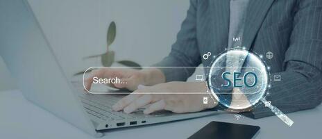 Search engine optimization SEO concept on dark blue background. Internet technology for business companies. Large magnifying glass for monitoring and analyzing data. photo