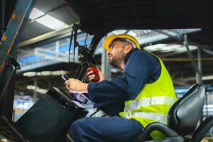 Forklift driver talking on radio for professional cargo shipping communication photo