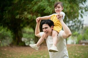 Image of young Asian father and daughter photo