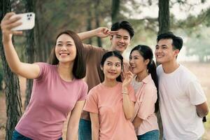 Group Asian people picnic outside photo