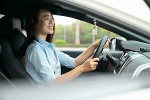 Young Asian woman with car photo