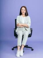 Photo of young Asian businesswoman on background