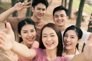 Group Asian people picnic outside photo