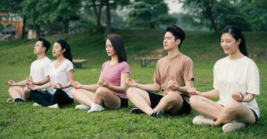 Group Asian people excercise at park photo