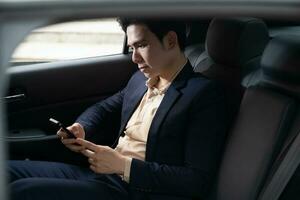 Young Asian business man with car photo