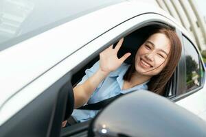 Young Asian woman with car photo