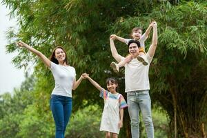 Young Asian family in the park photo