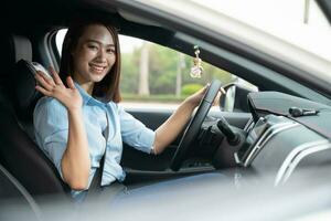 Young Asian woman with car photo