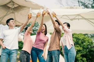 Group Asian people picnic outside photo