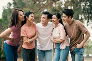 Group Asian people picnic outside photo