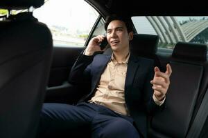 Young Asian business man with car photo