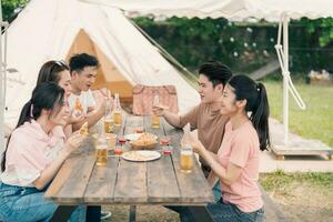 Group Asian people picnic outside photo