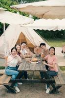 Group Asian people picnic outside photo