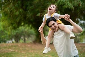 Image of young Asian father and daughter photo