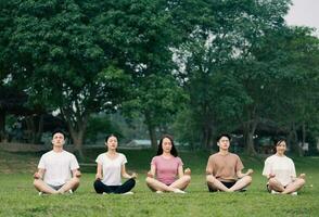 Group Asian people excercise at park photo