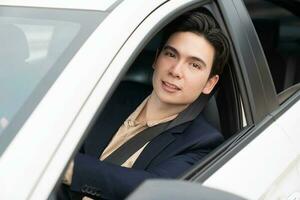 Young Asian business man with car photo