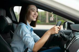 Young Asian woman with car photo