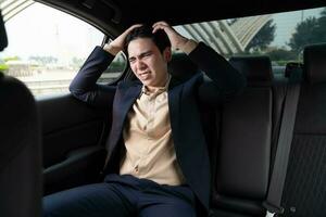 Young Asian business man with car photo