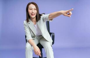 Photo of young Asian businesswoman on background