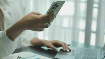 Portrait of Young Asian woman hand freelancer is working her job on computer tablet in modern office. Doing accounting analysis report real estate investment data, Financial and tax systems concept. video