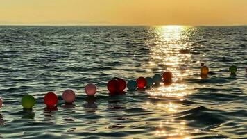 Balloons in Sea Water Near the Sea video