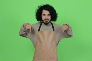 pose of a male bartender wearing a brown apron photo