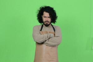 pose of a male bartender wearing a brown apron photo