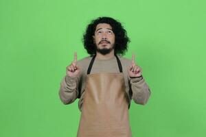 pose of a male bartender wearing a brown apron photo