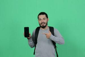 bearded asian student expression using smartphone photo