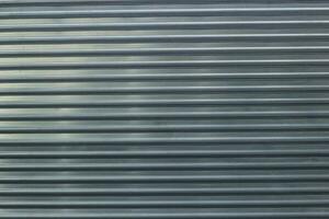 Photo of an abstract metal fence horizontal stripes.