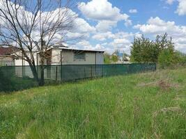 Installation of a protective mesh on the fence photo