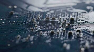 Computer electronic circuit board with radial conductor tracks and SMD capacitors rotating macro video