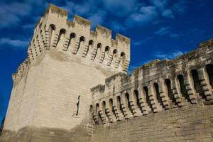 Detail of the historical wall built on the fourteenth century around the Avignon city in a beautiful sunny day photo